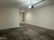 A spacious garage with white walls and a concrete floor at 40816 W Sunland Dr, Maricopa, AZ 85138