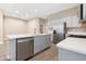 Bright kitchen featuring a large island, stainless steel appliances, and grey cabinets at 40816 W Sunland Dr, Maricopa, AZ 85138