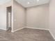 Cozy living area showcasing tile flooring and fresh paint, offering a blank canvas for your personal touch at 40816 W Sunland Dr, Maricopa, AZ 85138