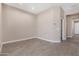 Inviting living space with tile flooring and neutral walls, ready for personalization and comfortable living at 40816 W Sunland Dr, Maricopa, AZ 85138