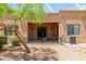 Charming backyard featuring a covered patio with desert landscaping and mature desert tree for enjoying the outdoors at 4241 N Pebblecreek Pkwy # 7, Goodyear, AZ 85395