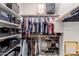 Organized walk-in closet with shelving and hanging storage for clothes and accessories at 4241 N Pebblecreek Pkwy # 7, Goodyear, AZ 85395