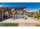 Stunning community pool area with pergola and mature landscaping, perfect for enjoying the outdoors at 4241 N Pebblecreek Pkwy # 7, Goodyear, AZ 85395