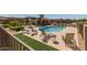 Inviting community pool with comfortable lounge chairs and well-maintained landscaping for relaxing and enjoying the sun at 4241 N Pebblecreek Pkwy # 7, Goodyear, AZ 85395