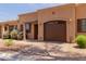 Beautiful desert home with a private garage, covered entryway, and gorgeous brick paved driveway at 4241 N Pebblecreek Pkwy # 7, Goodyear, AZ 85395