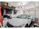 Organized garage space with ample storage shelves and a parked SUV at 4241 N Pebblecreek Pkwy # 7, Goodyear, AZ 85395