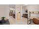 Hallway leading to the kitchen and living area with decorative accents at 4241 N Pebblecreek Pkwy # 7, Goodyear, AZ 85395