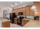 Well-lit kitchen with stainless steel appliances, granite countertops, and ample cabinet space at 4241 N Pebblecreek Pkwy # 7, Goodyear, AZ 85395