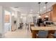 Open kitchen flows to the living area, featuring a breakfast bar and stainless steel appliances at 4241 N Pebblecreek Pkwy # 7, Goodyear, AZ 85395
