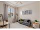 Living room offering comfortable seating and natural light with modern decor at 4241 N Pebblecreek Pkwy # 7, Goodyear, AZ 85395