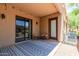 Inviting covered patio with stylish rug and seating, perfect for outdoor relaxation and enjoying the desert ambiance at 4241 N Pebblecreek Pkwy # 7, Goodyear, AZ 85395