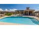 Inviting community pool with blue water, sun deck, and lounge seating for residents at 4241 N Pebblecreek Pkwy # 7, Goodyear, AZ 85395