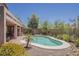 Private backyard showcasing a pool, covered patio, beautiful landscaping and privacy fence at 4293 S Columbine Way, Gold Canyon, AZ 85118