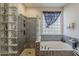 Full bathroom features a bathtub and standing shower with unique tile work at 4293 S Columbine Way, Gold Canyon, AZ 85118