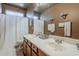 Bright bathroom features a double sink vanity, large mirror, and stylish fixtures at 4293 S Columbine Way, Gold Canyon, AZ 85118