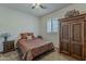 Bedroom with decorative wooden furniture, a window, and carpeted floor at 4293 S Columbine Way, Gold Canyon, AZ 85118