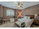 Bedroom with a carpeted floor, a ceiling fan and large window for natural light at 4293 S Columbine Way, Gold Canyon, AZ 85118