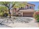 Lovely two-story home with attractive landscaping, mature shade tree and a two-car garage at 4293 S Columbine Way, Gold Canyon, AZ 85118