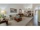 Bright and open living area with high ceilings, elegant furnishings, and seamless flow to dining at 4293 S Columbine Way, Gold Canyon, AZ 85118