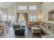 Bright living room features tile floors, comfortable seating, and views to the outside at 4293 S Columbine Way, Gold Canyon, AZ 85118