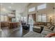 Open concept living space with eat-in kitchen, lots of light, tile floors, and comfortable seating at 4293 S Columbine Way, Gold Canyon, AZ 85118