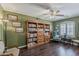 Cozy living room with built-in bookcase, plush seating, and natural light at 4293 S Columbine Way, Gold Canyon, AZ 85118