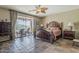 The main bedroom features a large bed, dark wood furniture, and access to the patio at 4293 S Columbine Way, Gold Canyon, AZ 85118