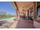 Spacious covered patio with ceiling fan and a view of the pool at 4293 S Columbine Way, Gold Canyon, AZ 85118