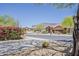 Charming exterior view featuring desert landscaping and a scenic mountain backdrop at 4293 S Columbine Way, Gold Canyon, AZ 85118