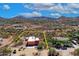 An aerial view of the home and property and the surrounding mountains at 44421 N 12Th St, New River, AZ 85087