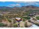 Expansive desert property featuring a well-maintained home with desert landscaping, outlined in a yellow boundary at 44421 N 12Th St, New River, AZ 85087