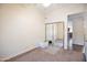 Spare bedroom with mirrored closet and ceiling fan at 44421 N 12Th St, New River, AZ 85087