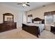 Bedroom featuring carpet flooring, neutral walls, a ceiling fan, and a wooden bed frame at 44421 N 12Th St, New River, AZ 85087