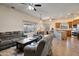 Spacious living room with open floor plan to kitchen and dining area at 44421 N 12Th St, New River, AZ 85087