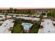 Aerial view of a charming community with a refreshing pool and meticulously maintained landscaping at 446 S 77Th St, Mesa, AZ 85208