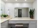 Bathroom featuring vanity with seating, large mirror, and sleek finishes at 446 S 77Th St, Mesa, AZ 85208