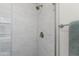 This bathroom features a stand up shower, towel rack and white tile at 446 S 77Th St, Mesa, AZ 85208