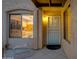Charming home entrance with a covered porch and a cozy seating area at 446 S 77Th St, Mesa, AZ 85208