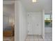 Bright and spacious hallway leading to the bedrooms, front door, and kitchen at 446 S 77Th St, Mesa, AZ 85208