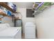 This utility room features a washer, dryer, water heater, shelving and storage at 446 S 77Th St, Mesa, AZ 85208