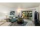 Bright living room with comfortable seating and sliding glass doors to the outside at 446 S 77Th St, Mesa, AZ 85208