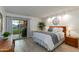 Comfortable bedroom with sliding glass door access to the backyard patio at 446 S 77Th St, Mesa, AZ 85208