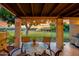 Relaxing covered patio with outdoor seating and views of the surrounding green space at 446 S 77Th St, Mesa, AZ 85208