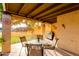 Cozy covered patio with outdoor seating, a grill, and views of the yard at 446 S 77Th St, Mesa, AZ 85208
