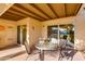 Outdoor patio with seating, a glass table, and seamless indoor-outdoor living at 446 S 77Th St, Mesa, AZ 85208