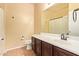 Bathroom vanity with a sink, dark wood cabinets, and ceramic tile floors at 45309 W Gavilan Dr, Maricopa, AZ 85139