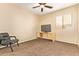 Bedroom with carpet floors, a desk, and a large window at 45309 W Gavilan Dr, Maricopa, AZ 85139