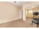 Bedroom with carpet floors, a desk, a mirrored closet and a ceiling fan at 45309 W Gavilan Dr, Maricopa, AZ 85139