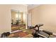 Exercise room with workout equipment and mirrored closet doors at 45309 W Gavilan Dr, Maricopa, AZ 85139