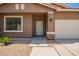 Welcoming home exterior highlighting desert landscaping, rock accents, and a covered entry for curb appeal at 45309 W Gavilan Dr, Maricopa, AZ 85139